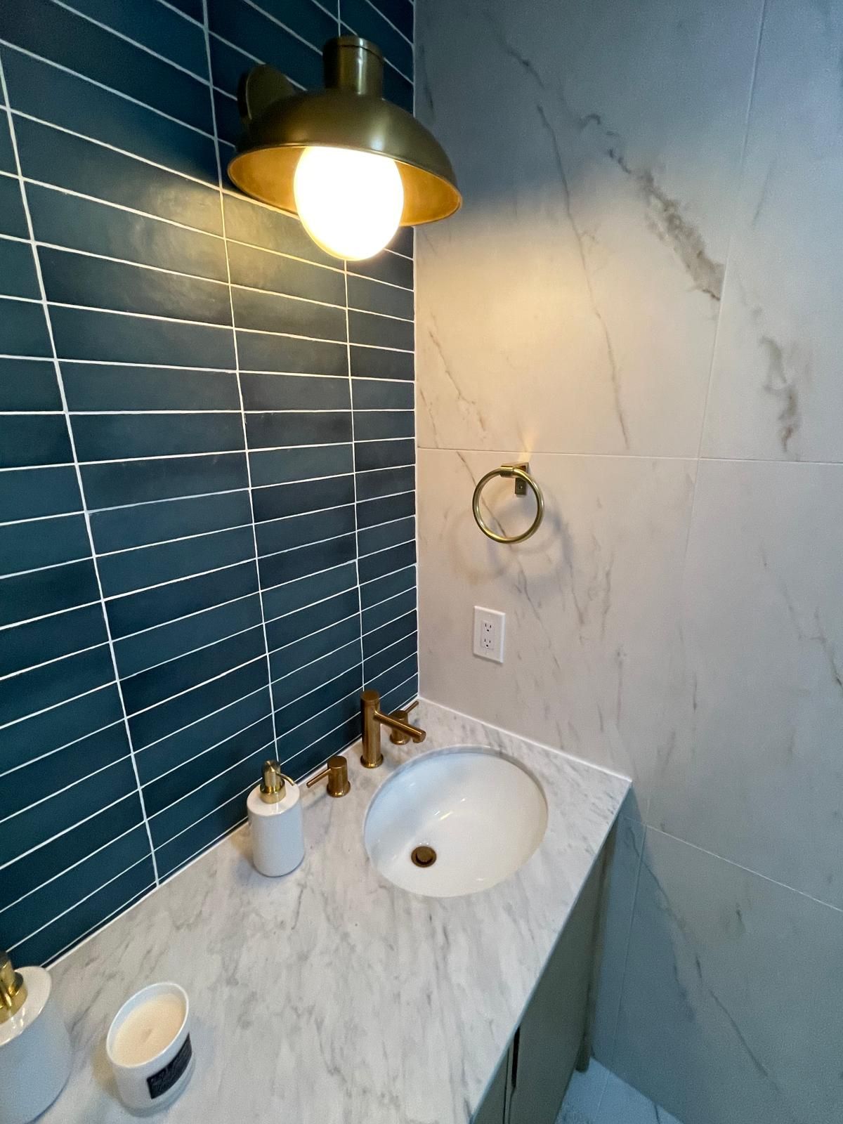 Elegant powder room with brass fixtures