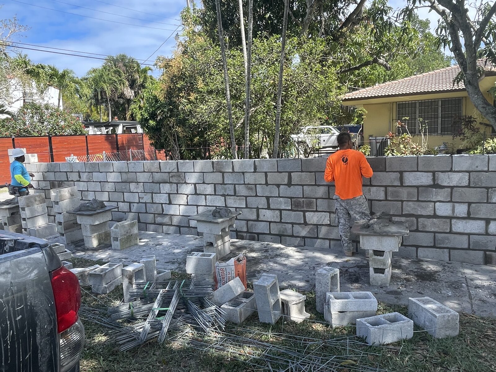 Worker on block wall construction