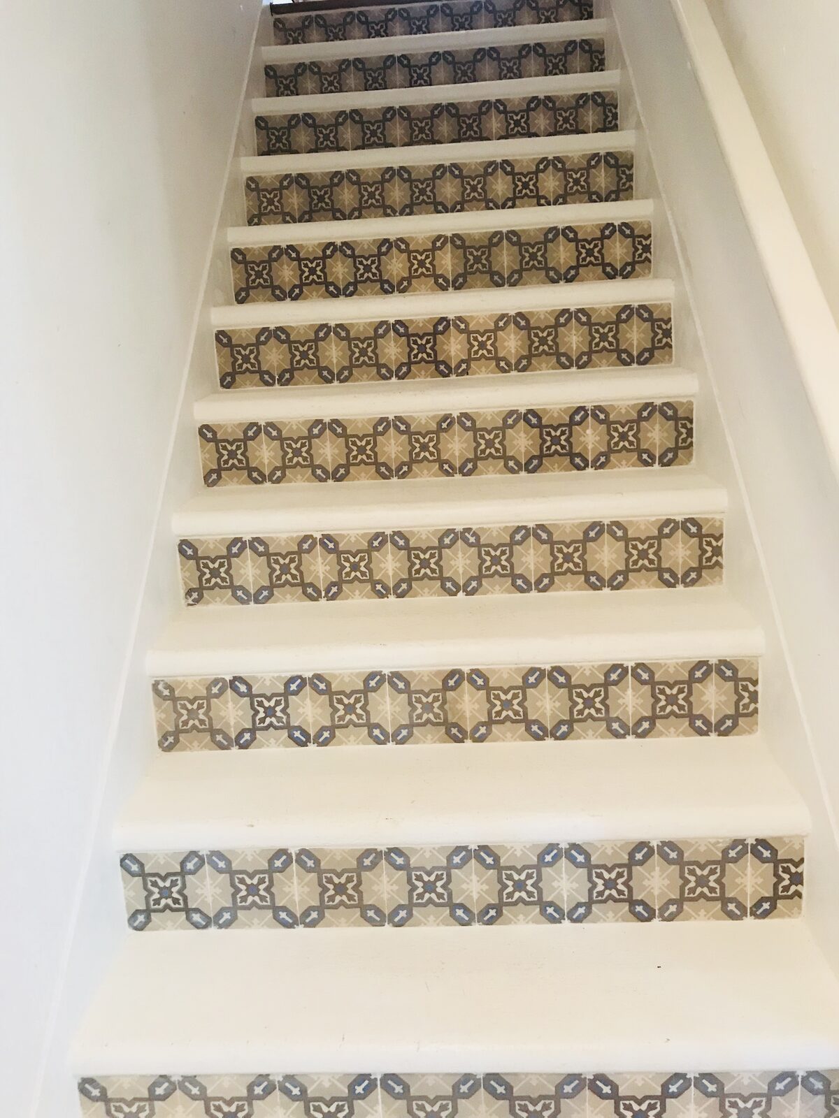 Patterned tile risers on staircase