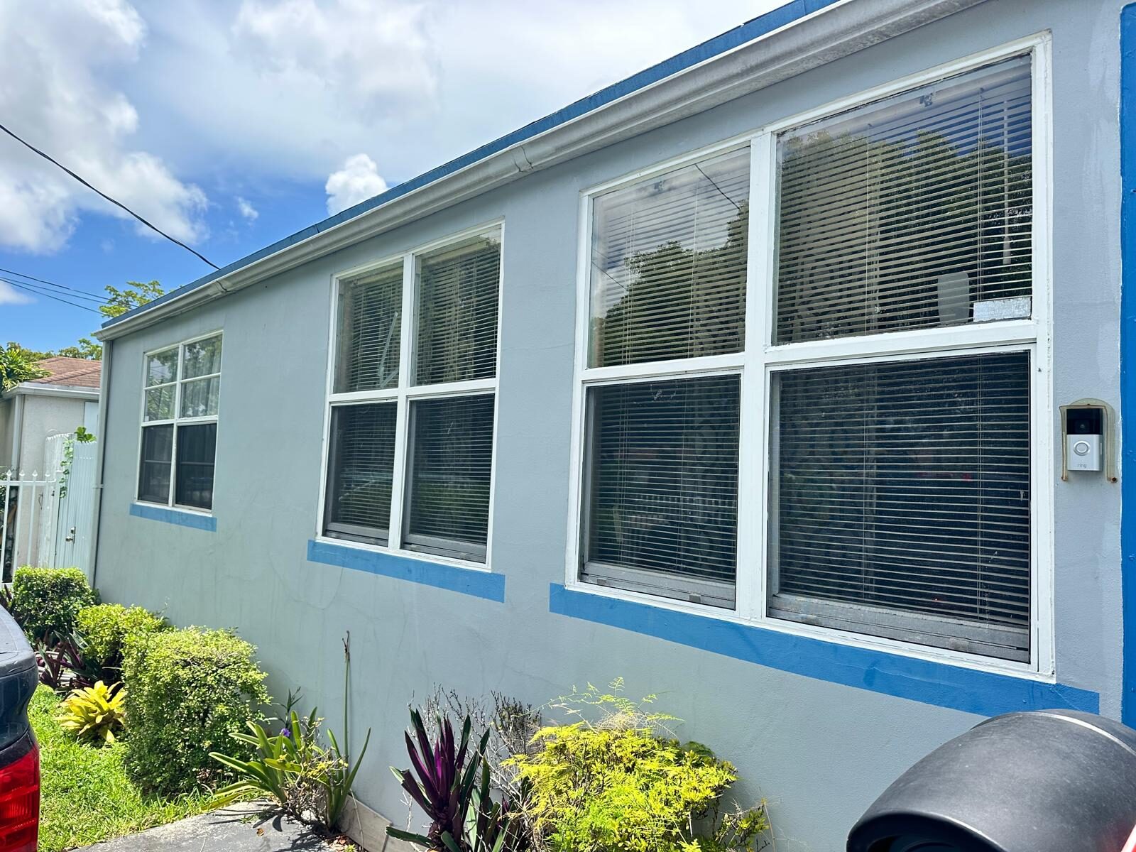 Multiple new impact windows on home exterior