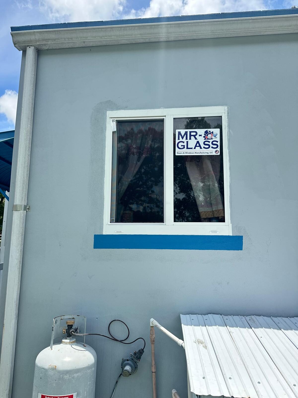 Single impact window with fresh paint trim